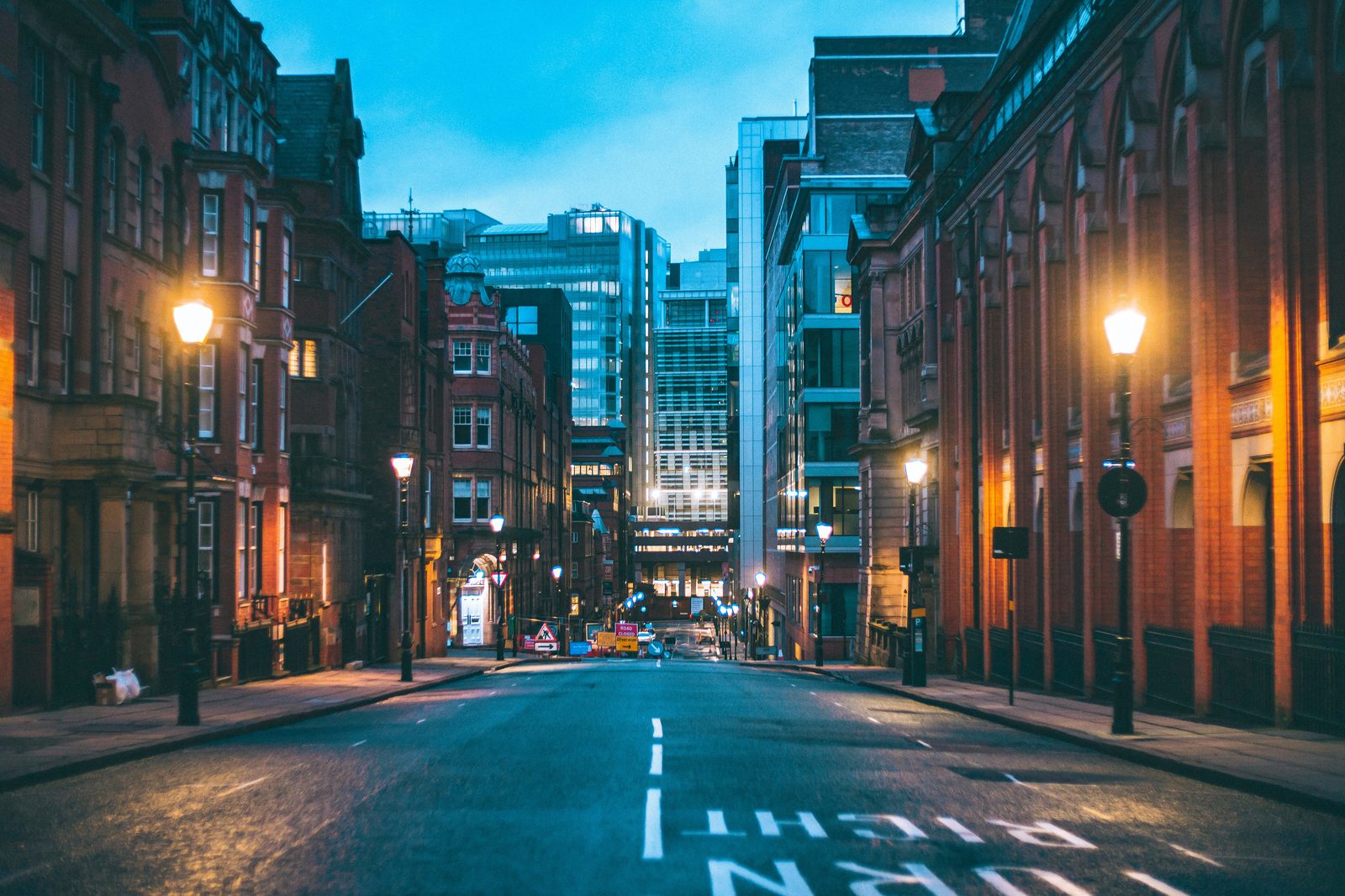 Birmingham city street at dusk with Victorian buildings and modern architecture