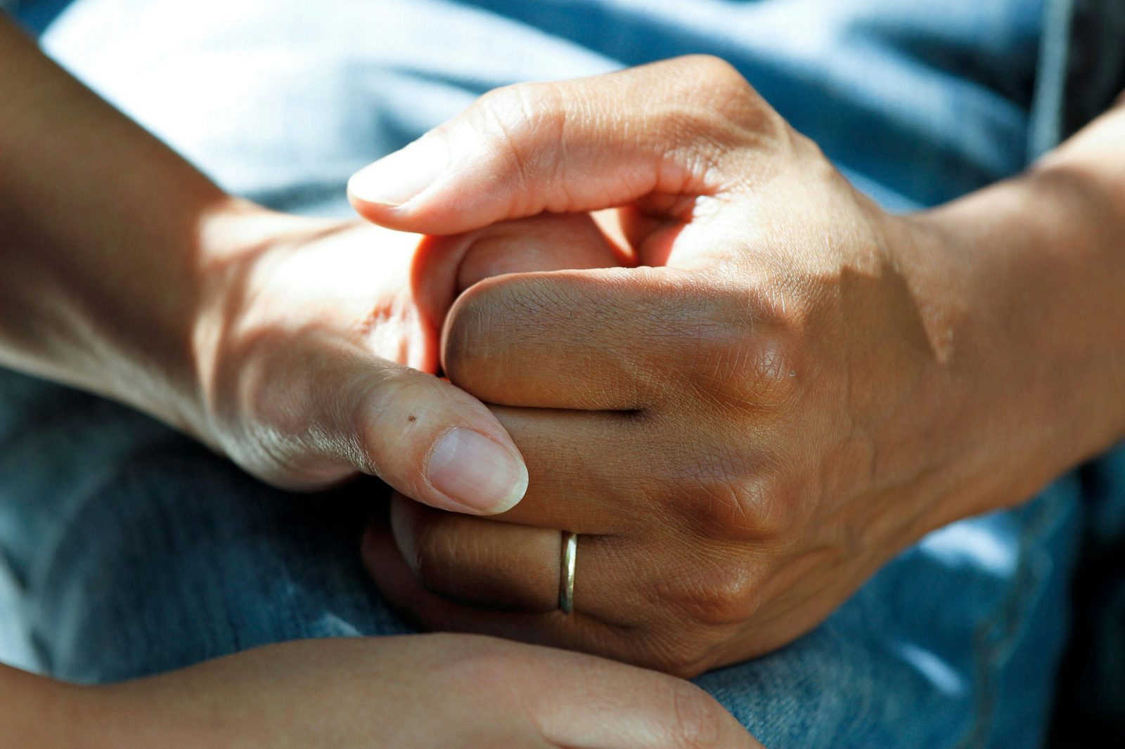 Carer hands providing gentle support
